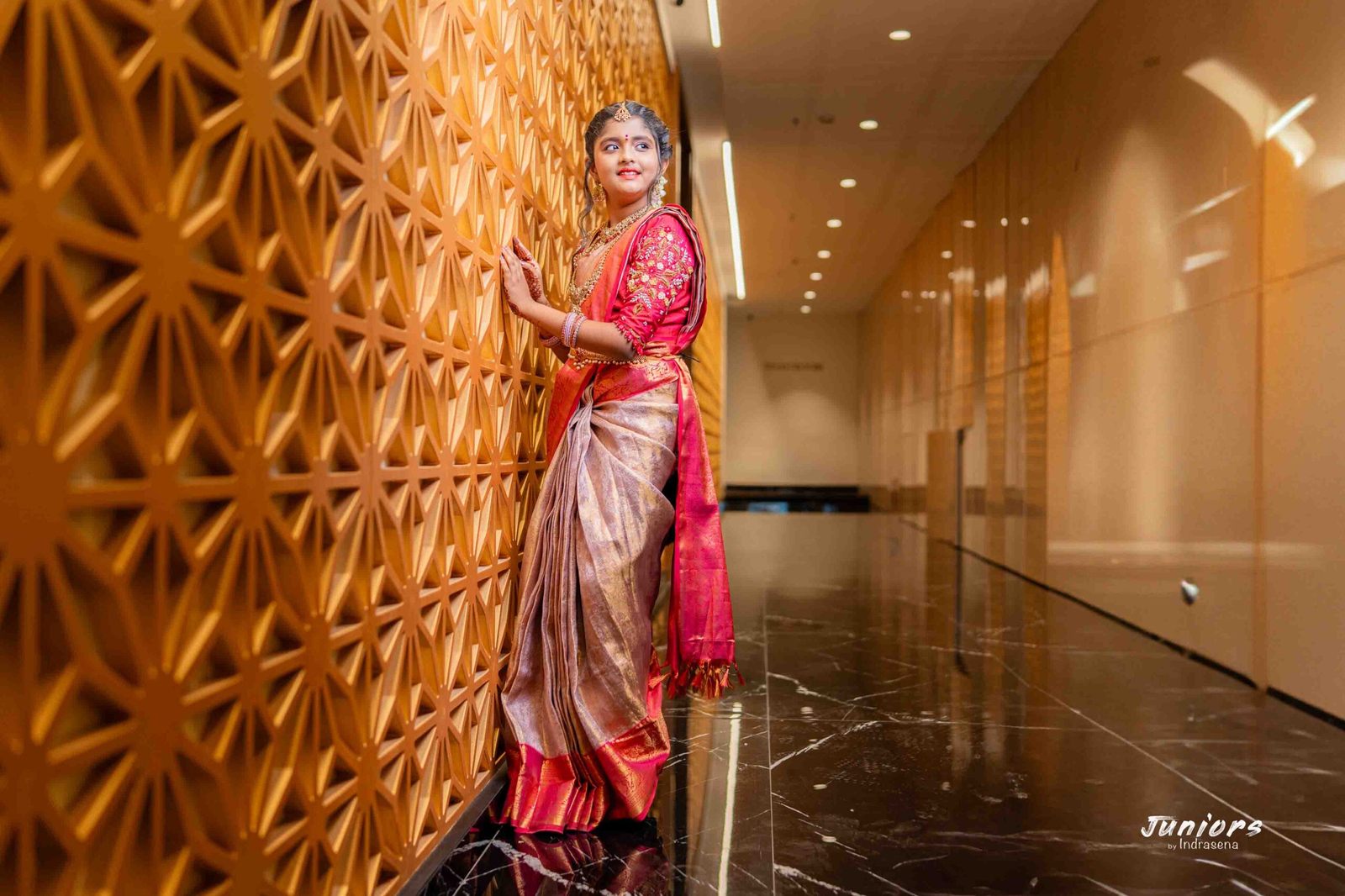 a girl standing and pose for camera